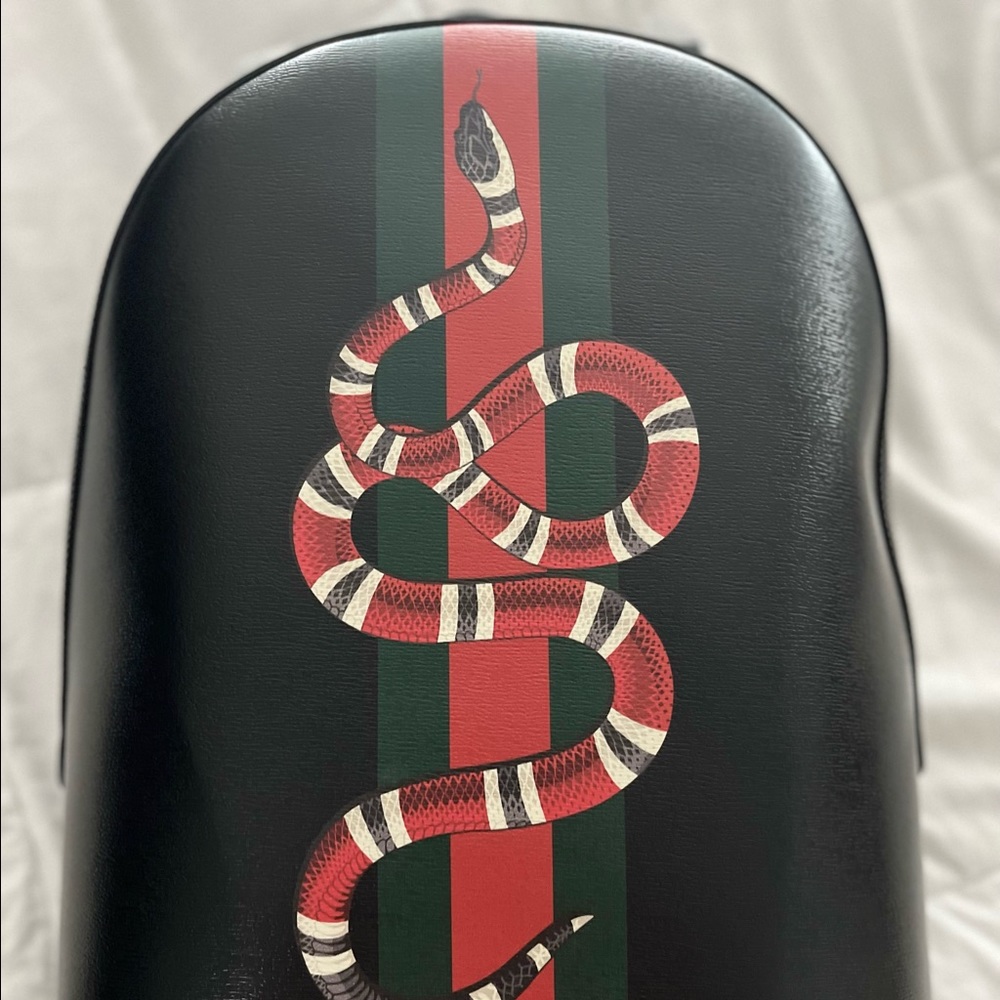 Gucci Web and Kingsnake Print Leather backpack.